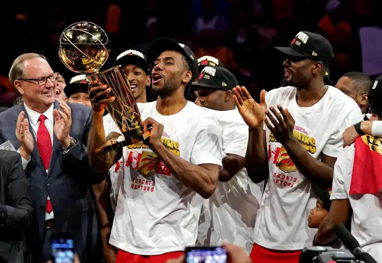 Jun 13, 2019; Oakland, CA, USA; Toronto Raptors forward Kawhi Leonard (2) celebrates with the Larry O'Brien Trophy after the Golden State Warriors in game six of the 2019 NBA Finals at Oracle Arena. Mandatory Credit: Kyle Terada-Imagn Images