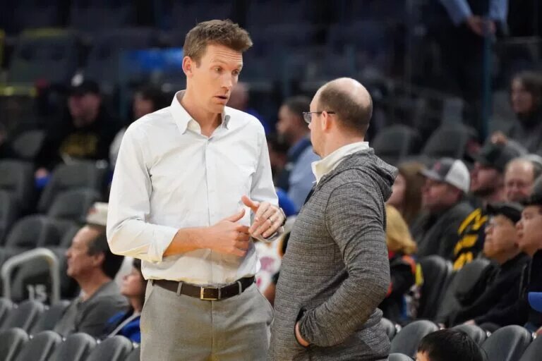 Golden State Warriors general manager Mike Dunleavy chats before the game against the Memphis Grizzlies
