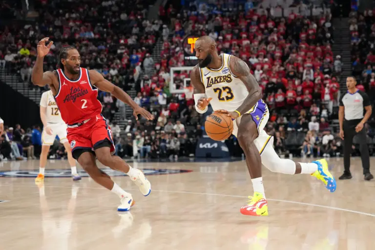 Los Angeles Lakers forward Lebron James (23) dribbles the ball against LA Clippers forward Kawhi Leonard (2) in the second half at Intuit Dome.