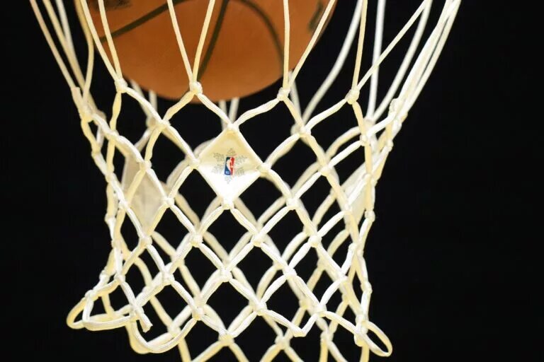The NBA Christmas logo appears on the net