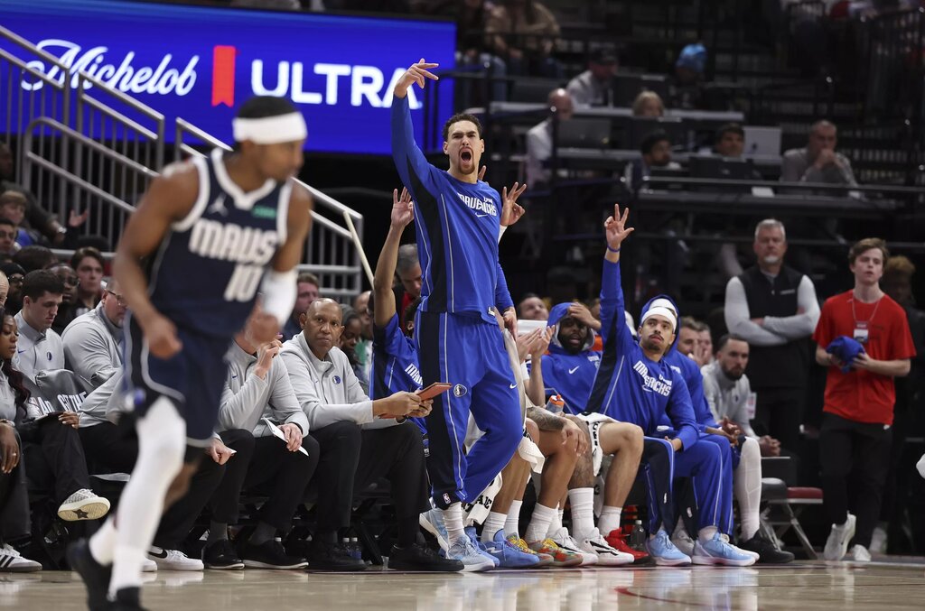 Jan 31, 2026; Houston, Texas, USA; Dallas Mavericks forward Dwight Powell (7) reacts from the bench after a play during the first quarter against the Houston Rockets at Toyota Center. Mandatory Credit: Troy Taormina-Imagn Images