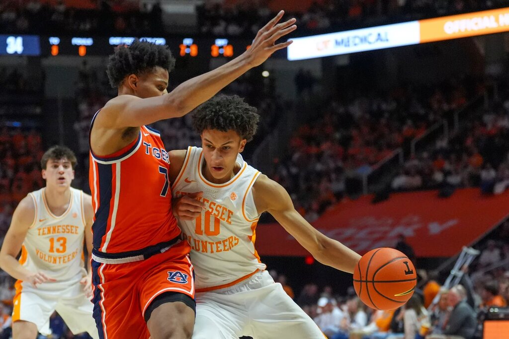 Tennessee forward Nate Ament (10) pushes against Auburn forward Keyshawn Hall (7) during a NCAA basketball game between the Tennessee Volunteers and Auburn Tigers at Thompson-Boling Arena at Food City Center in Knoxville, Tenn., on Jan. 31, 2026. © Angelina Alcantar/News Sentinel / USA TODAY NETWORK via Imagn Images