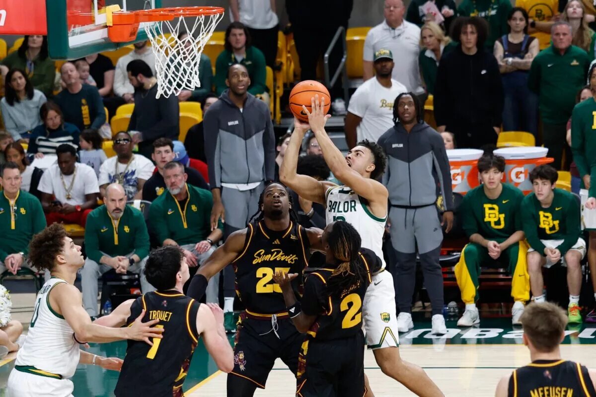 Feb 21, 2026; Waco, Texas, USA; Baylor Bears guard Isaac Williams (10) scores a basket over Arizona State Sun Devils guard Anthony Johnson (2) during the second half at Paul and Alejandra Foster Pavilion. Mandatory Credit: Chris Jones-Imagn Images