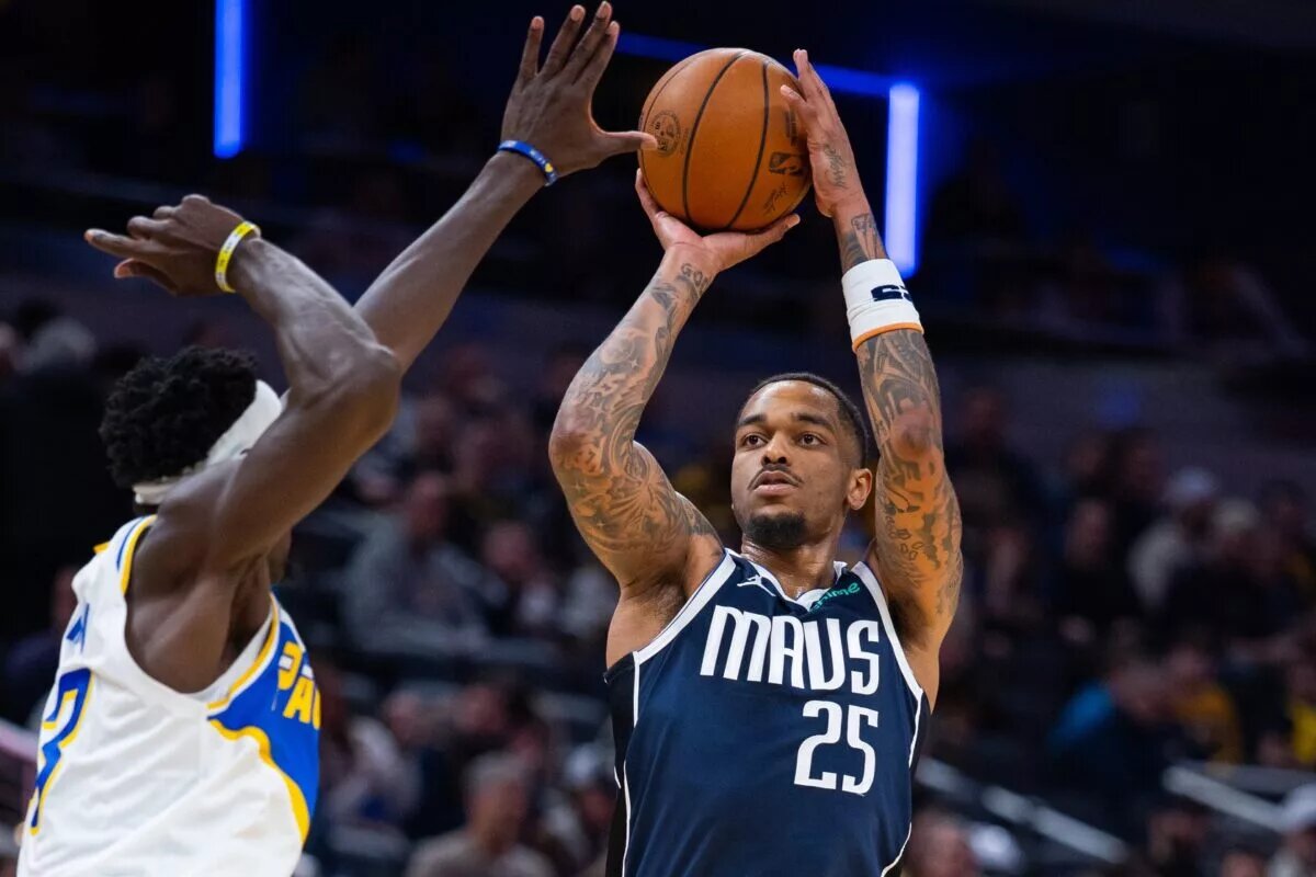 Feb 22, 2026; Indianapolis, Indiana, USA; Dallas Mavericks forward P.J. Washington (25) shoots the ball while Indiana Pacers forward Pascal Siakam (43) defends in the second half at Gainbridge Fieldhouse. Mandatory Credit: Trevor Ruszkowski-Imagn Images