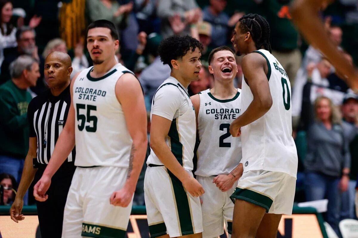 Colorado State Rams guard Brandon Rechsteiner (2) reacts with guard Jase Butler (4) and forward Carey Booth (0) and forward Jevin Muniz (55) in the second half against the Fresno State Bulldogs at Moby Arena.