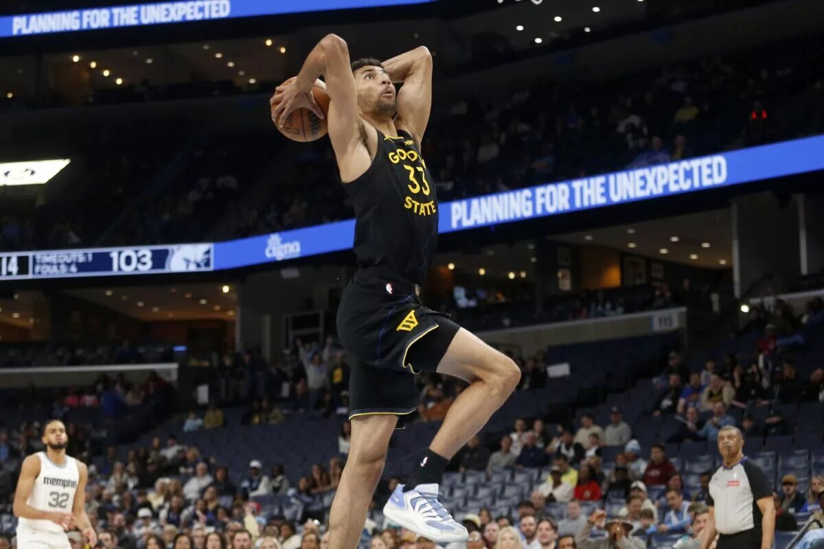Feb 25, 2026; Memphis, Tennessee, USA; Golden State Warriors forward Malevy Leons (33) drives to the basket during the fourth quarter against the Memphis Grizzlies at FedExForum. Mandatory Credit: Petre Thomas-Imagn Images