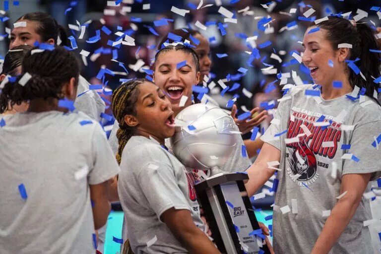 Feb 26, 2026; Hartford, Connecticut, USA; UConn Huskies guard Azzi Fudd (35), guard Kelis Fisher (7), guard Caroline Ducharme (33) and teammates celebrate their Big East Regular Season Title after defeating the Georgetown Hoyas at PeoplesBank Arena. Mandatory Credit: David Butler II-Imagn Images