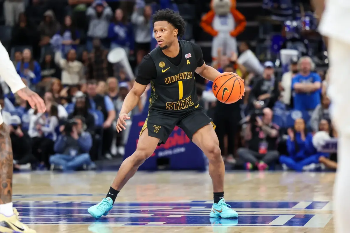 Feb 26, 2026; Memphis, Tennessee, USA; Wichita State Shockers guard Kenyon Giles (1) handles the ball against the Memphis Tigers during the second half at FedExForum. Mandatory Credit: Wesley Hale-Imagn Images