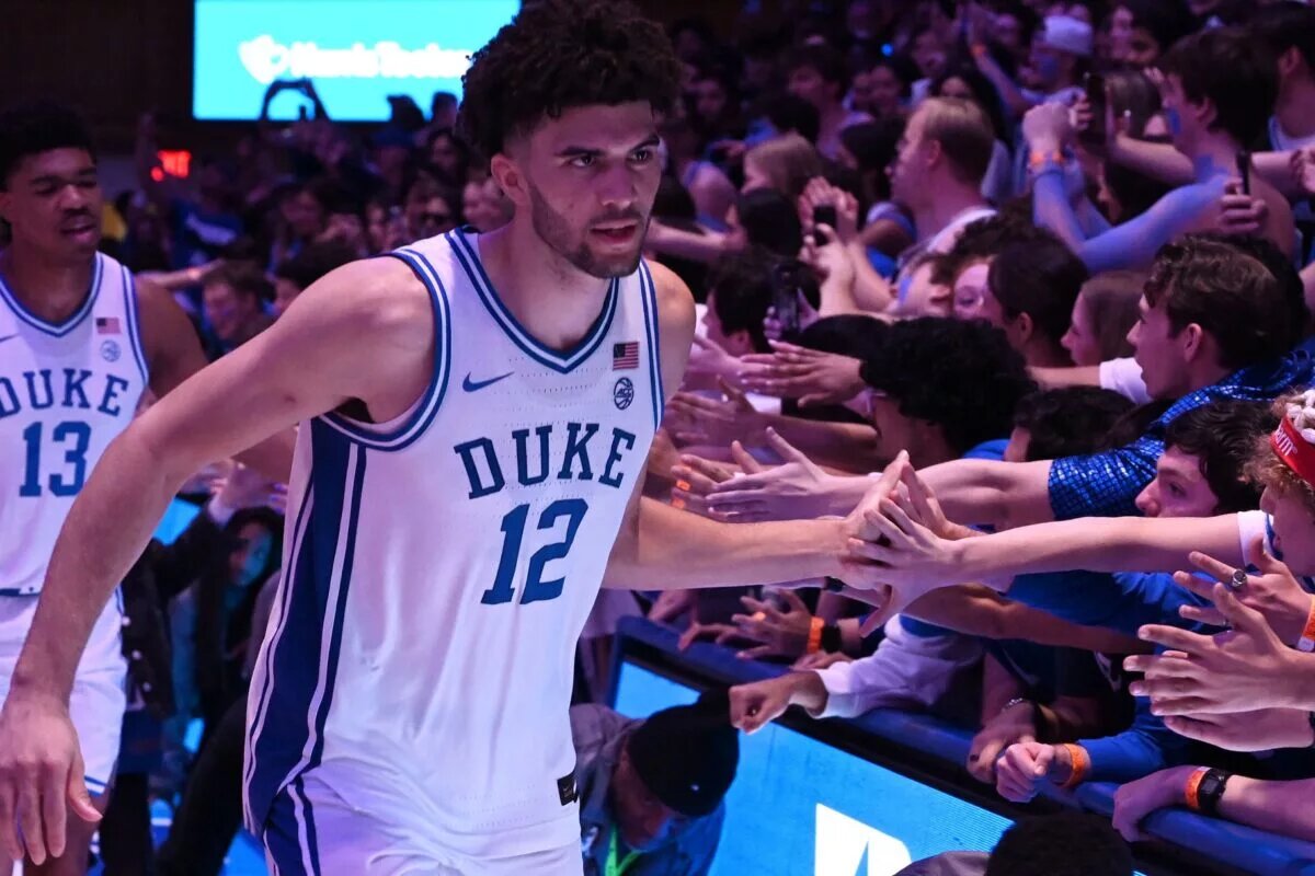 Duke Blue Devils forward Cameron Boozer (12) greets fans after a win over the Virginia Cavaliers at Cameron Indoor Stadium. Duke won 77-51.
