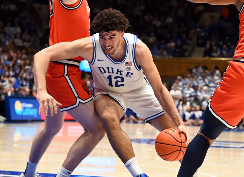 Duke Blue Devils forward Cameron Boozer (12) drives to the basket during the second half against the Virginia Cavaliers at Cameron Indoor Stadium. Duke won 77-51.