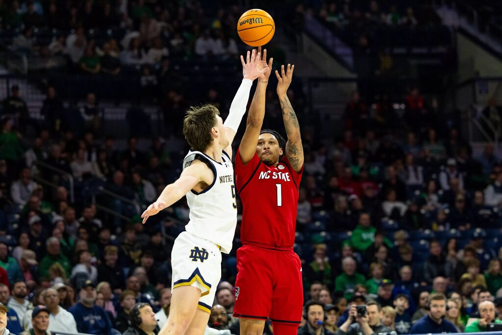  NC State Wolfpack forward Darrion Williams (1) shoots as Notre Dame Fighting Irish guard Cole Certa (5) defends during the second half at Purcell Pavilion at the Joyce Center.