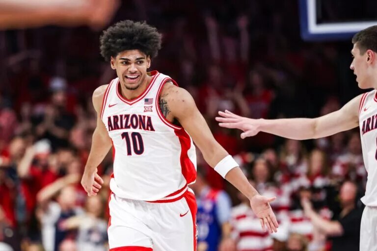Arizona Wildcats forward Koa Peat (10) celebrates during the first half of the game against the Kansas Jayhawks at McKale Memorial Center.