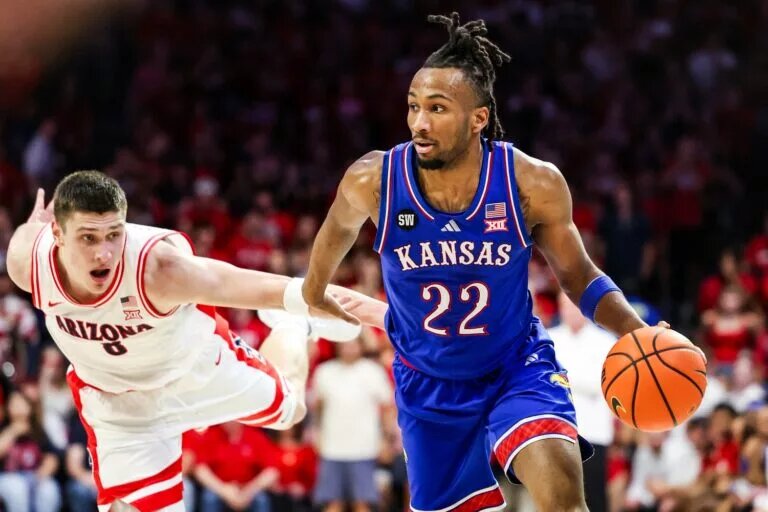 Kansas Jayhawks guard Darryn Peterson (22) dribbles the ball during the first half of the game against the Arizona Wildcats at McKale Memorial Center.