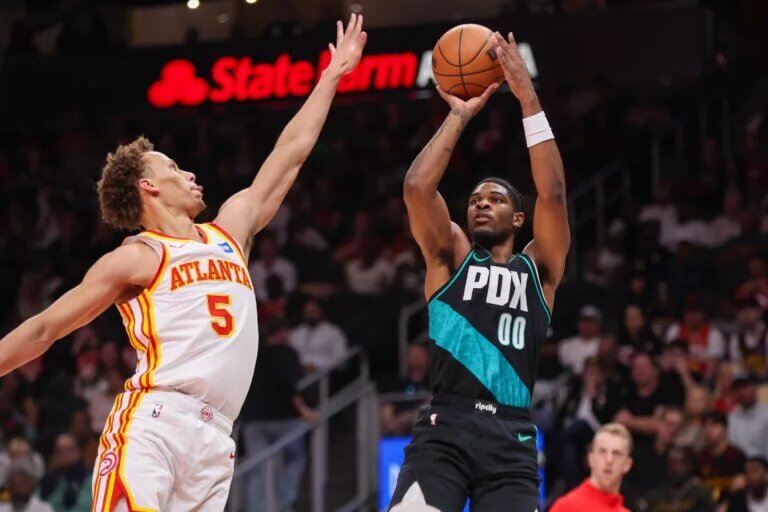 Mar 1, 2026; Atlanta, Georgia, USA; Portland Trail Blazers guard Scoot Henderson (00) shoots over Atlanta Hawks guard Dyson Daniels (5) in the second quarter at State Farm Arena. Mandatory Credit: Brett Davis-Imagn Images