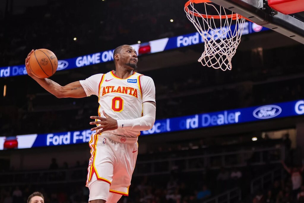 Atlanta Hawks forward Jonathan Kuminga (0) dunks against the Portland Trail Blazers in the fourth quarter at State Farm Arena.
