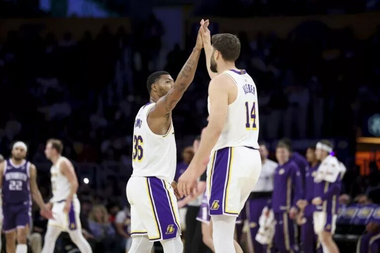 Mar 1, 2026; Los Angeles, California, USA; Los Angeles Lakers guard Marcus Smart (36) and forward Maxi Kleber (14) high five during the second quarter against the Sacramento Kings at Crypto.com Arena. Mandatory Credit: William Navarro-Imagn Images