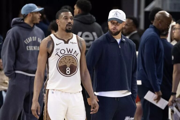 Mar 2, 2026; San Francisco, California, USA; Golden State Warriors guard De'Anthony Melton (8) talks with injured teammate Stephen Curry during the fourth quarter against the Los Angeles Clippers at Chase Center. Mandatory Credit: D. Ross Cameron-Imagn Images