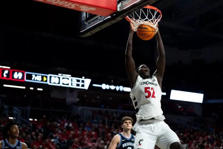 Cincinnati Bearcats center Moustapha Thiam (52) dunks in the second half of the NCAA Basketball game at Fifth Third Arena in Cincinnati on Tuesday, March 3, 2026.