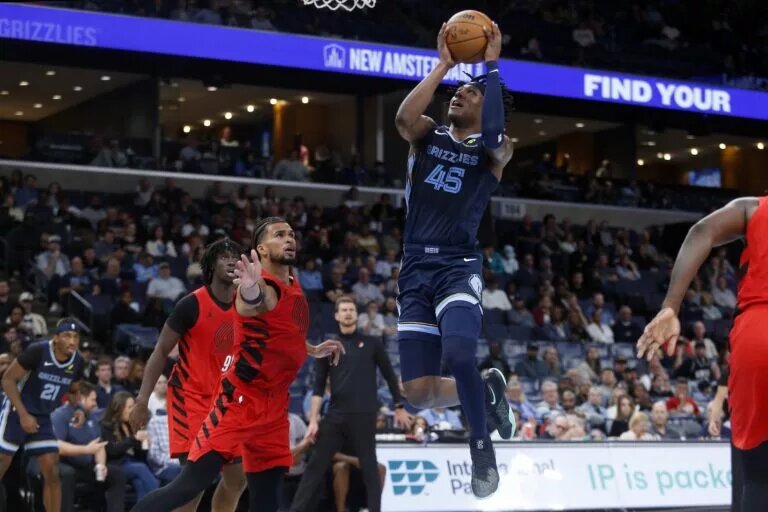 Mar 4, 2026; Memphis, Tennessee, USA; Memphis Grizzlies forward GG Jackson (45) drives to the basket as Portland Trail Blazers forward Toumani Camara (33) defends during the fourth quarter at FedExForum. Mandatory Credit: Petre Thomas-Imagn Images