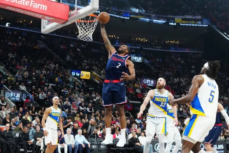 LA Clippers forward Kawhi Leonard (2) dunks the ball against the Indiana Pacers in the first half at Intuit Dome.
