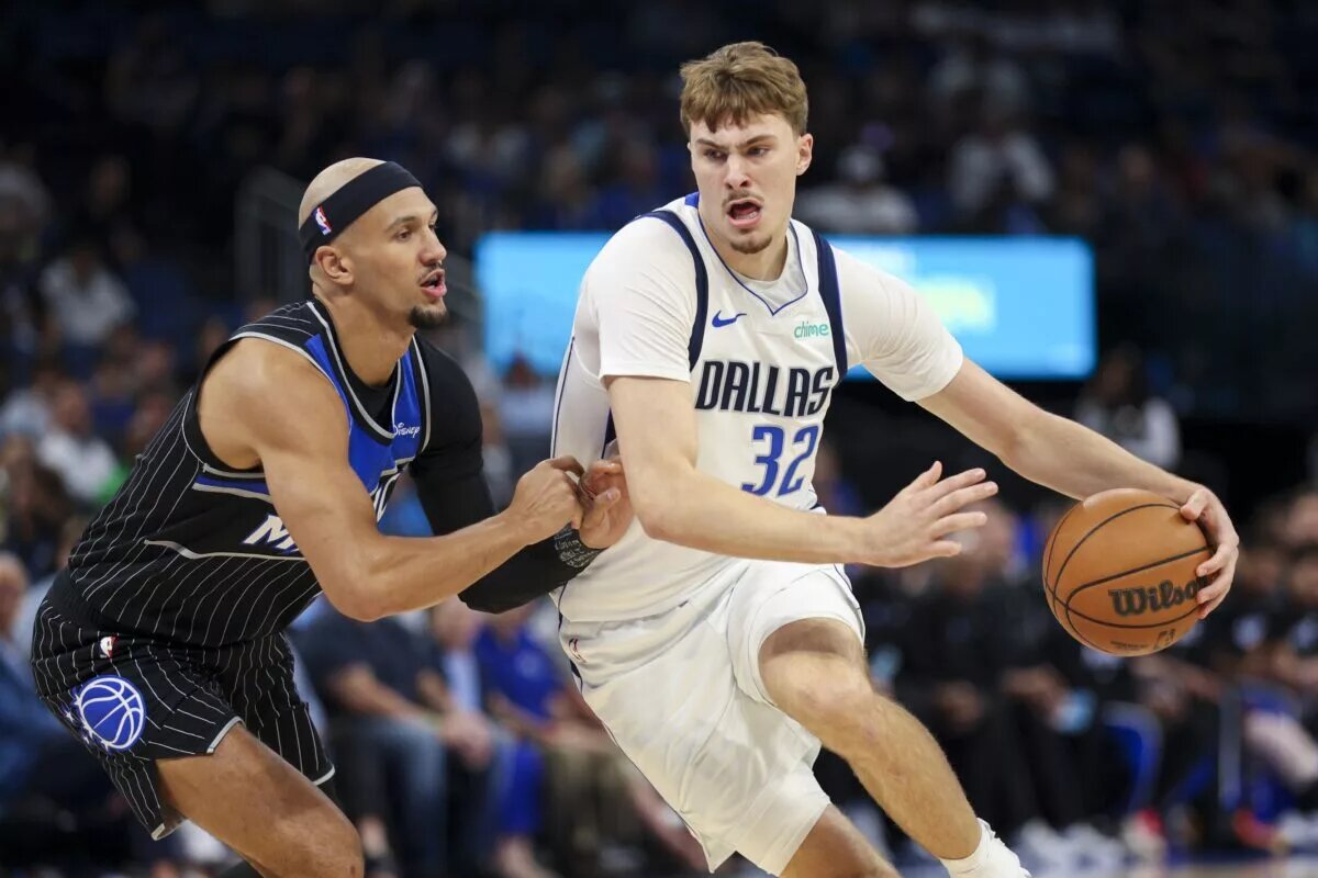 Mar 5, 2026; Orlando, Florida, USA; Dallas Mavericks forward Cooper Flagg (32) is guarded by Orlando Magic guard Jalen Suggs (4) in the first quarter at Kia Center. Mandatory Credit: Nathan Ray Seebeck-Imagn Images
