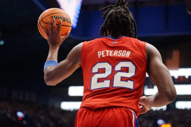 Kansas Jayhawks guard Darryn Peterson (22) passes the ball against Kansas State Wildcats during the Sunflower Showdown game inside Allen Fieldhouse in Lawrence, Kansas, on Saturday, March 7, 2026.