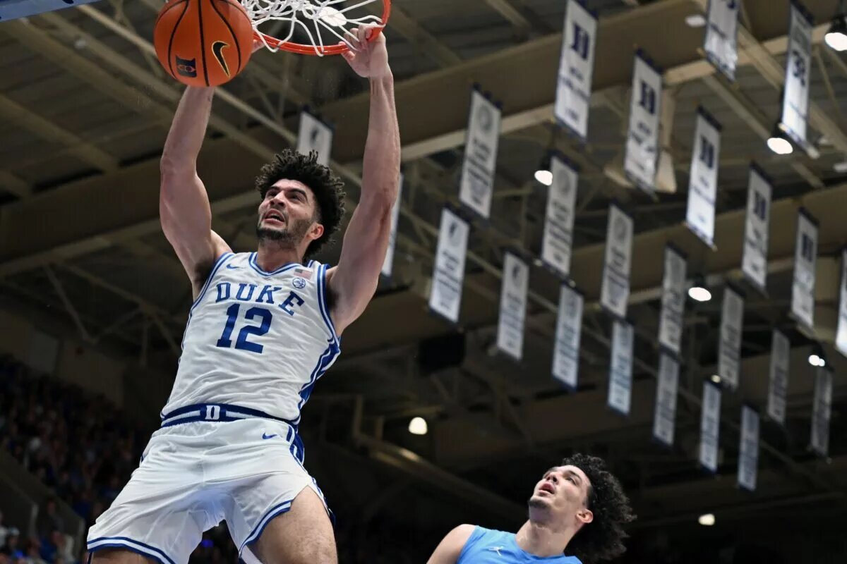 Duke Blue Devils forward Cameron Boozer (12) dunks during the second half against the North Carolina Tar Heels at Cameron Indoor Stadium. The Duke Blue Devils won 76-61.
