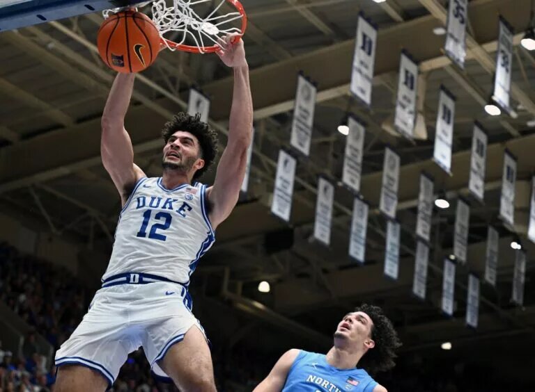 Duke Blue Devils forward Cameron Boozer (12) dunks during the second half against the North Carolina Tar Heels at Cameron Indoor Stadium. The Duke Blue Devils won 76-61.