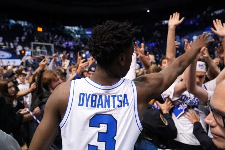 BYU Cougars forward AJ Dybantsa (3) celebrates with fans after a win over the Texas Tech Red Raiders at Marriott Center.