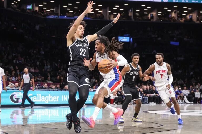 Mar 10, 2026; Brooklyn, New York, USA; Detroit Pistons guard Daniss Jenkins (24) drives past Brooklyn Nets forward Jalen Wilson (22) in the fourth quarter at Barclays Center. Mandatory Credit: Wendell Cruz-Imagn Images