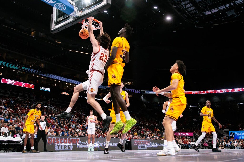 Mar 11, 2026; Kansas City, MO, USA; Iowa State Cyclones forward Blake Buchanan (23) dunks in front of Arizona State Sun Devils center Massamba Diop (35) during the first half at T-Mobile Center. Mandatory Credit: William Purnell-Imagn Images