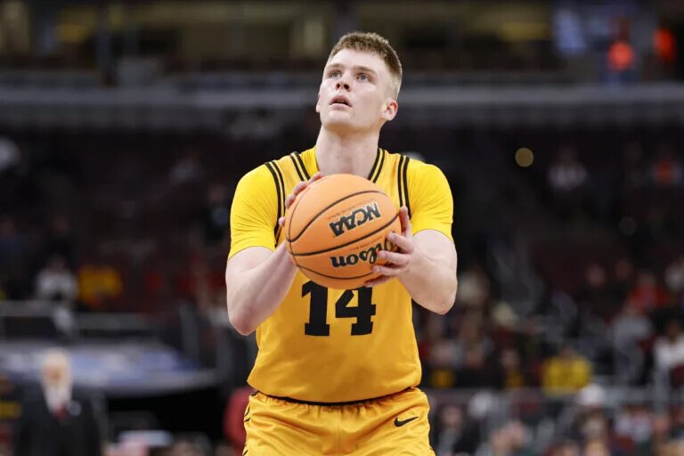 Iowa Hawkeyes guard Bennett Stirtz (14) shoots a free throw against the Maryland Terrapins during the second half at United Center.