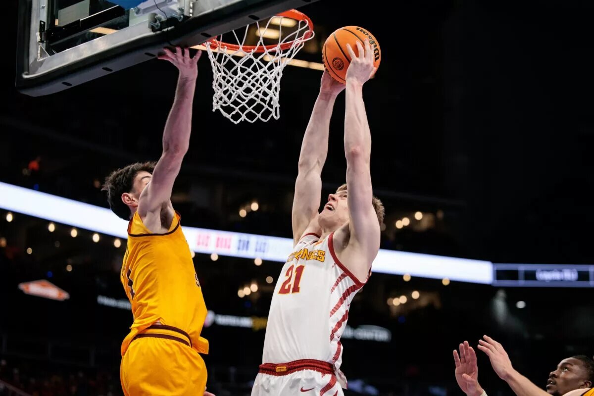 Mar 11, 2026; Kansas City, MO, USA; Iowa State Cyclones forward Dominykas Pleta (21) shoots the ball around Arizona State Sun Devils forward Santiago Trouet (1) during the first half at T-Mobile Center. Mandatory Credit: William Purnell-Imagn Images