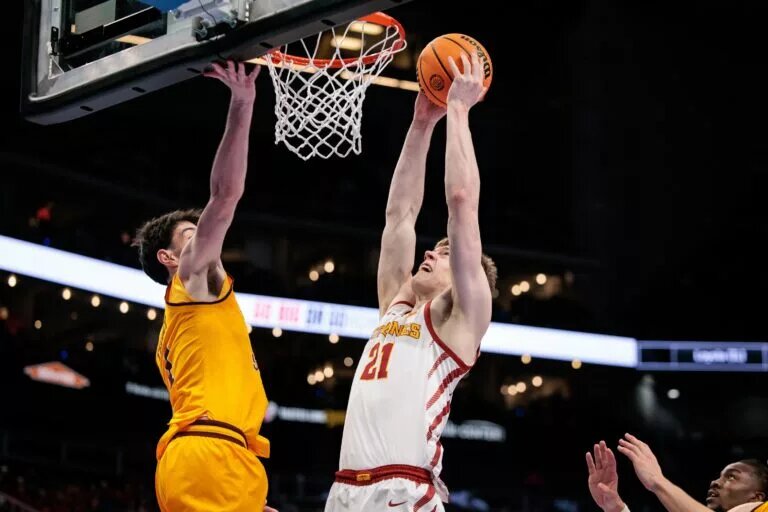 Mar 11, 2026; Kansas City, MO, USA; Iowa State Cyclones forward Dominykas Pleta (21) shoots the ball around Arizona State Sun Devils forward Santiago Trouet (1) during the first half at T-Mobile Center. Mandatory Credit: William Purnell-Imagn Images