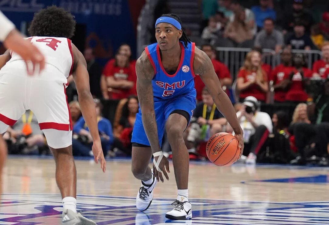 Southern Methodist University Mustangs guard Jaron Pierre Jr. (5) dribbles during the second half against the Louisville Cardinals at Spectrum Center.