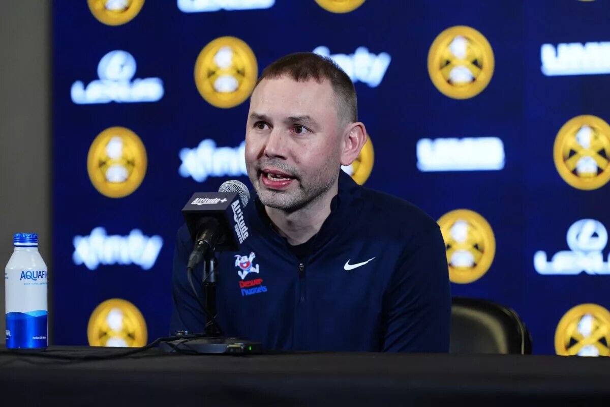 Denver Nuggets head coach David Adelman speaks to the media before the game against the Houston Rockets at Ball Arena.