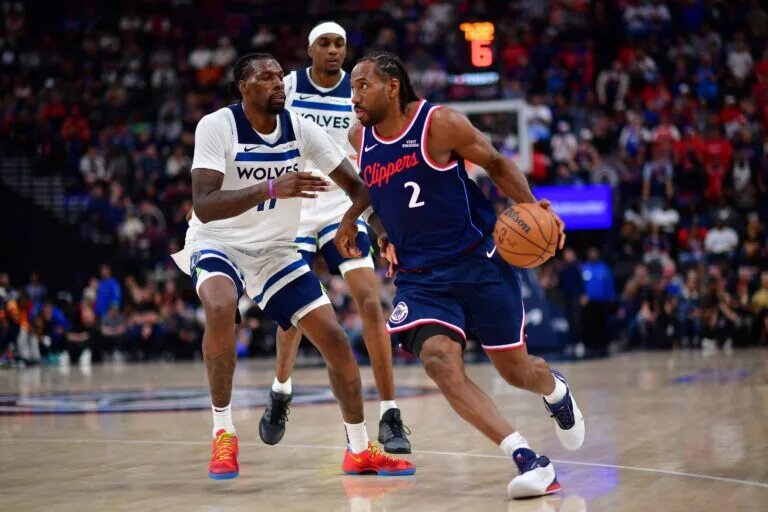 Mar 11, 2026; Inglewood, California, USA; Los Angeles Clippers guard Jordan Miller (22) moves to the basket against Minnesota Timberwolves center Naz Reid (11) during the second half at Intuit Dome. Mandatory Credit: Gary A. Vasquez-Imagn Images