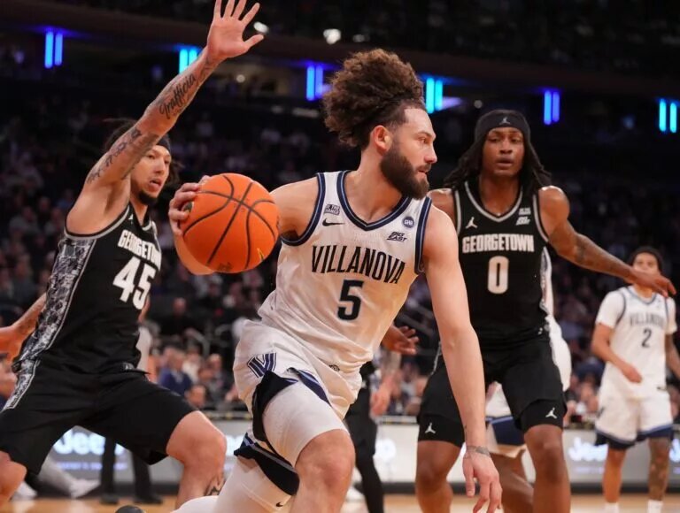 Mar 12, 2026; New York, NY, USA; Villanova Wildcats guard Devin Askew (5) moves the ball against the Georgetown Hoyas during the first half at Madison Square Garden. Mandatory Credit: Robert Deutsch-Imagn Images