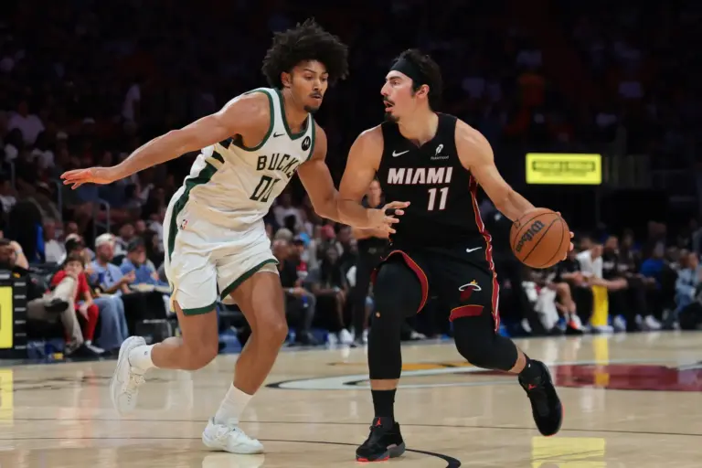 Mar 12, 2026; Miami, Florida, USA; Miami Heat forward Jaime Jaquez Jr. (11) drives to the basket against Milwaukee Bucks center Jericho Sims (00) during the third quarter at Kaseya Center. Mandatory Credit: Sam Navarro-Imagn Images