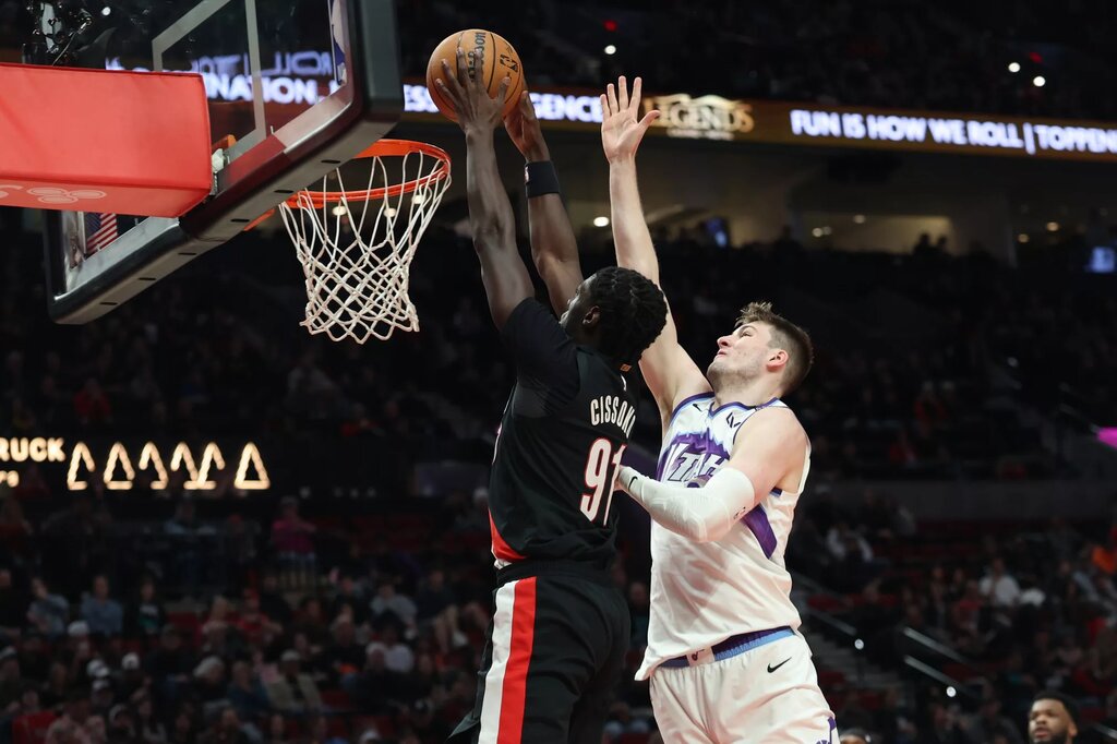  Portland Trail Blazers guard Sidy Cissoko (91) dunks the ball over Utah Jazz center Kyle Filipowski (22) during the second half at Moda Center.