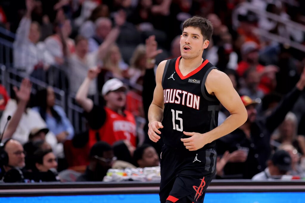 Houston Rockets guard Reed Sheppard (15) reacts after a made basket against the New Orleans Pelicans during the fourth quarter at Toyota Center.