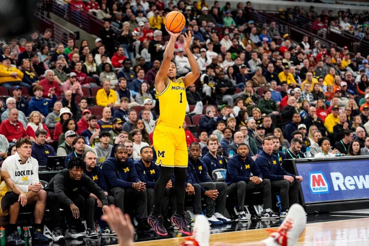 Michigan guard Trey McKenney (1) shoots a 3-pointer against Wisconsin during the second half of Big Ten Tournament semifinal at United Center in Chicago on Saturday, March 14, 2026.