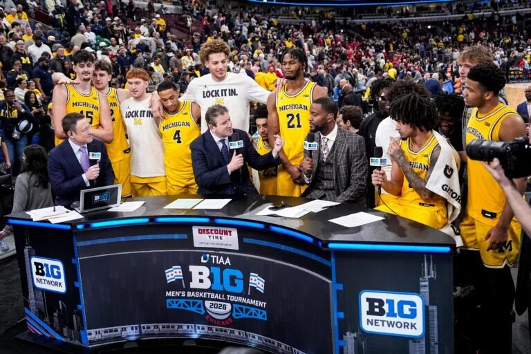 Michigan players show support for guard Elliot Cadeau (3) at post game interview to celebrate 68-65 win over Wisconsin at the Big Ten Tournament semifinal at United Center in Chicago on Saturday, March 14, 2026.