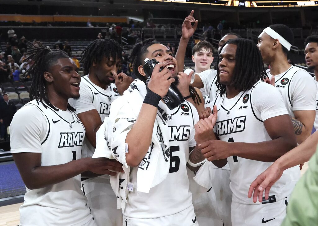 The VCU Rams celebrate after defeating the Saint Joseph's Hawks in an Atlantic 10 Conference Tournament semifinal game at PPG Paints Arena.