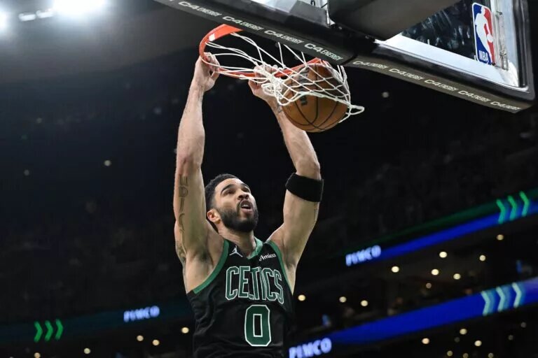 Boston Celtics forward Jayson Tatum (0) dunks and scores against the Washington Wizards during the second half at the TD Garden.