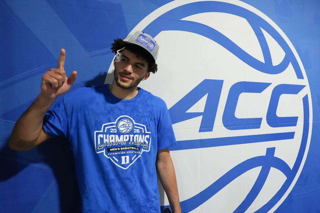 Mar 14, 2026; Charlotte, NC, USA; Duke Blue Devils forward Cameron Boozer (12) celebrates after defeating the Virginia Cavaliers in the men's ACC Conference Tournament Championship at Spectrum Center. Mandatory Credit: Bob Donnan-Imagn Images