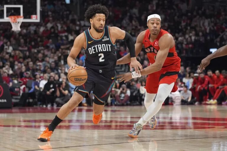 Detroit Pistons guard Cade Cunningham (2) drives to the basket against Toronto Raptors guard Scottie Barnes (4) during the first half at Scotiabank Arena.