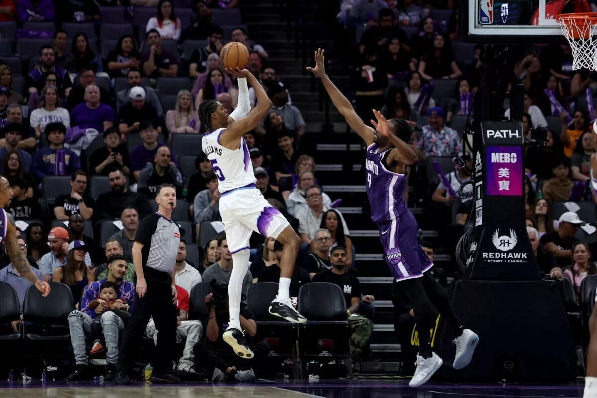 Utah Jazz forward Cody Williams (5) shoots over Sacramento Kings forward Precious Achiuwa (9)