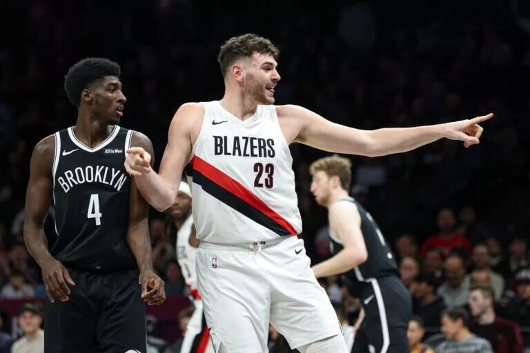 Portland Trail Blazers center Donovan Clingan (23) reacts after making a basket during the first half against the Brooklyn Nets at Barclays Center.