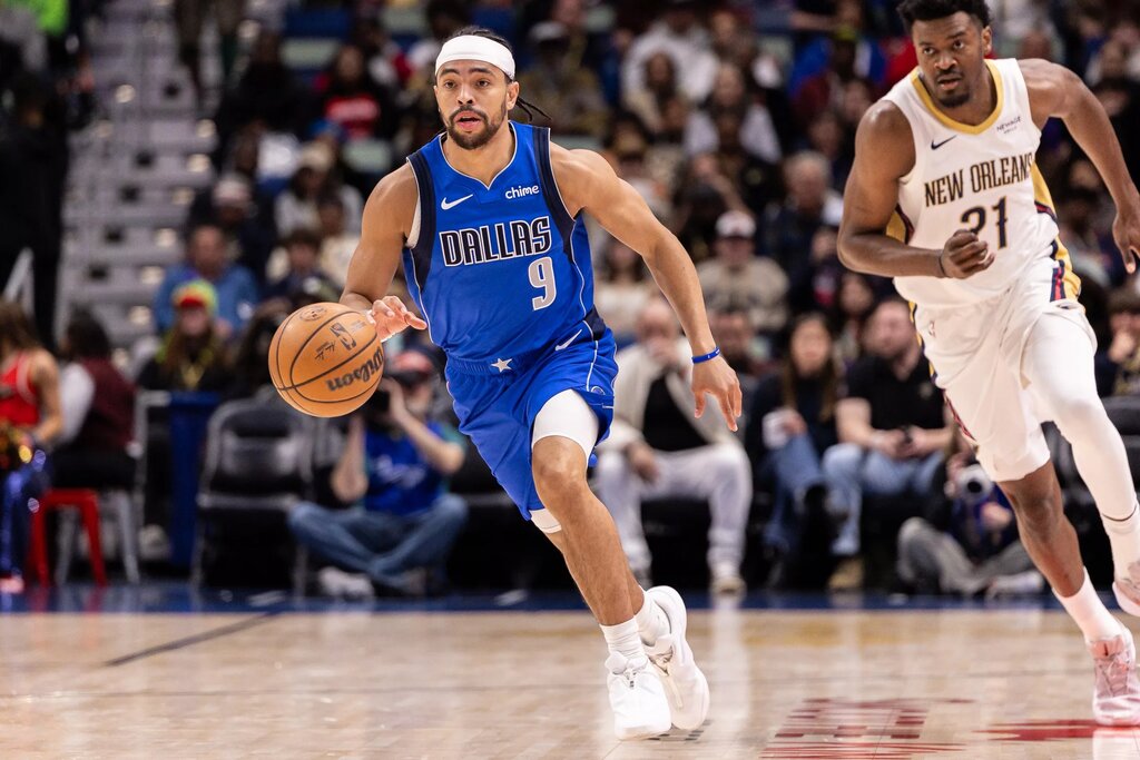 Mar 16, 2026; New Orleans, Louisiana, USA; Dallas Mavericks guard Ryan Nembhard (9) brings the ball up court against New Orleans Pelicans center Yves Missi (21) during the first half at Smoothie King Center. Mandatory Credit: Stephen Lew-Imagn Images